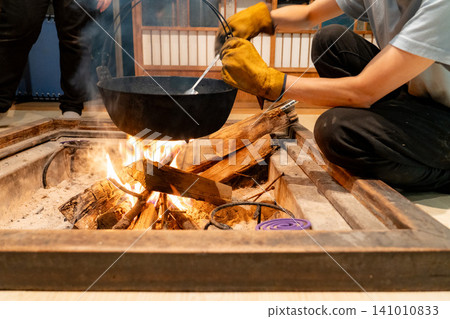 Iron pot dishes cooked over a hearth Iron pot dishes cooked over a hearth 141010833
