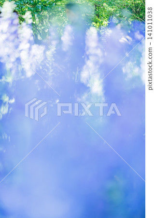 Abstract background material in blue and green with sunlight shining through. 141011038