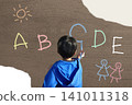 A primary school child studying English letters. 141011318