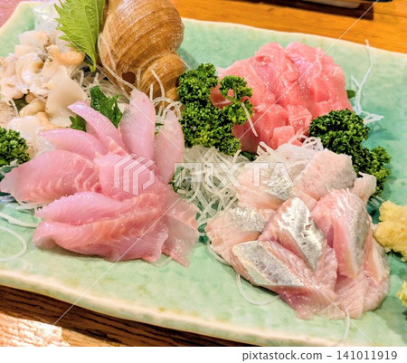 A colorful assortment of fresh sashimi. 141011919
