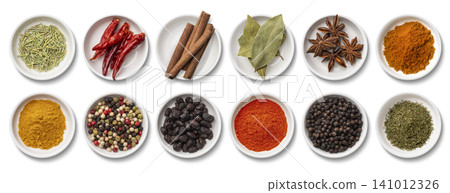 Various spices served on 12 white plates Various spices served on 12 white plates 141012326