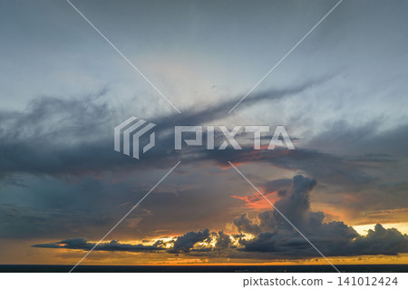 White fluffy cumulonimbus clouds forming before thunderstorm on evening sky. Changing stormy cloudscape weather at sunset White fluffy cumulonimbus clouds forming before thunderstorm on evening sky. Changing stormy cloudscape weather at sunset 141012424