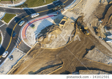 Industrial roadworks. Roundabout on wide American highway under construction. Development of transportation system for rapid transit 141012501