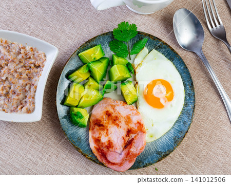 Breakfast: pork, avocado, scrambled eggs and buckwheat Breakfast: pork, avocado, scrambled eggs and buckwheat 141012506