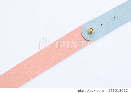 light blue and pink leather strap isolated on white background 141013012