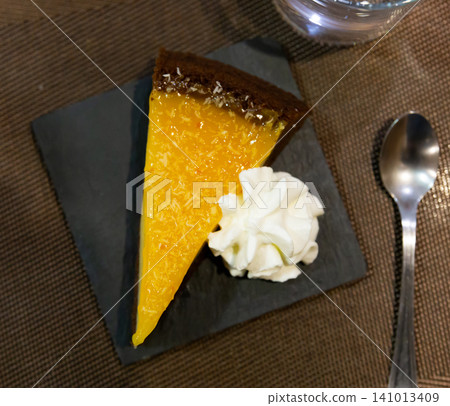 Slice of orange cake served for dessert Slice of orange cake served for dessert 141013409