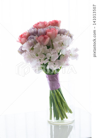 A bouquet of tulips and sweet peas 141013507