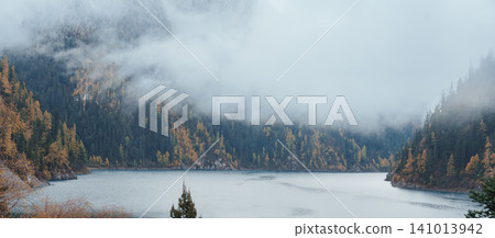 Scenery Jiuzhaigou national park in Sichuan, China. Beautiful Long lake and snow mountain in Autumn season. Famous Landmark and Vacation near Chengdu, China. Asia travel concept Scenery Jiuzhaigou national park in Sichuan, China. Beautiful Long lake and snow mountain in Autumn season. Famous Landmark and Vacation near Chengdu, China. Asia travel concept 141013942