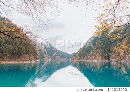 Scenery Jiuzhaigou national park in Sichuan, China. Beautiful Long lake and snow mountain in Autumn season. Famous Landmark and Vacation near Chengdu, China. Asia travel concept Scenery Jiuzhaigou national park in Sichuan, China. Beautiful Long lake and snow mountain in Autumn season. Famous Landmark and Vacation near Chengdu, China. Asia travel concept 141013950