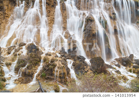Scenery Jiuzhaigou national park in Sichuan, China. Beautiful of Nuorilang Waterfall in Autumn season. Famous Landmark and Vacation near Chengdu, China. Asia travel concept Scenery Jiuzhaigou national park in Sichuan, China. Beautiful of Nuorilang Waterfall in Autumn season. Famous Landmark and Vacation near Chengdu, China. Asia travel concept 141013954