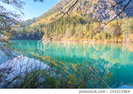 Scenery Jiuzhaigou national park in Sichuan, China. Beautiful of Arrow Bamboo Lake and snow mountain in Autumn season. Famous Landmark and Vacation near Chengdu, China. Asia travel concept Scenery Jiuzhaigou national park in Sichuan, China. Beautiful of Arrow Bamboo Lake and snow mountain in Autumn season. Famous Landmark and Vacation near Chengdu, China. Asia travel concept 141013964