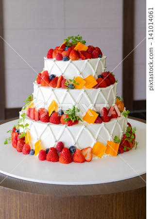 A gorgeous wedding cake with lots of fruit A gorgeous wedding cake with lots of fruit 141014061
