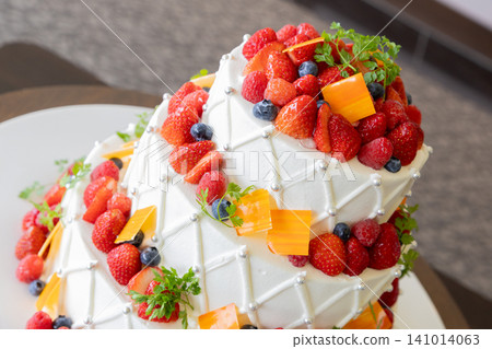A gorgeous wedding cake with lots of fruit A gorgeous wedding cake with lots of fruit 141014063