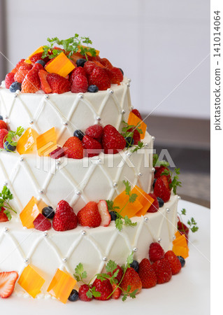 A gorgeous wedding cake with lots of fruit A gorgeous wedding cake with lots of fruit 141014064