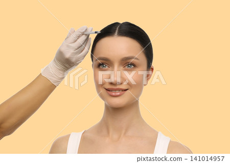 A woman receives skincare treatment in a clinical environment A woman receives skincare treatment in a clinical environment 141014957