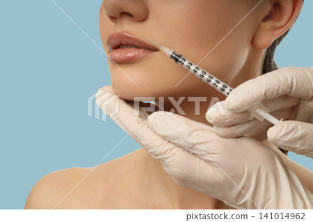 A healthcare expert performs a lip enhancement treatment A healthcare expert performs a lip enhancement treatment 141014962