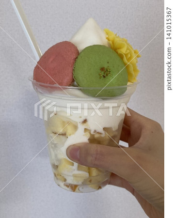 Yellow flowers and peach/green soft serve ice cream Yellow flowers and peach/green soft serve ice cream 141015367