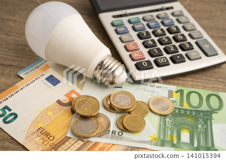Cost of electric utilities with light bulb for payment. Cost of electric utilities with light bulb for payment. 141015394