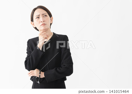 Woman in mourning clothes Funeral image 141015464