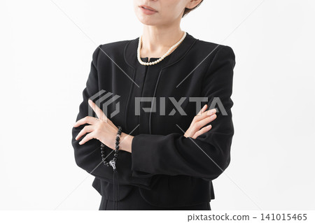 Woman in mourning clothes Funeral image 141015465