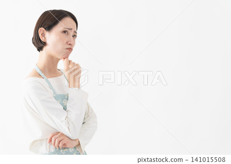 Woman wearing an apron Lifestyle image Woman wearing an apron Lifestyle image 141015508
