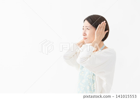 Woman wearing an apron Lifestyle image Woman wearing an apron Lifestyle image 141015553