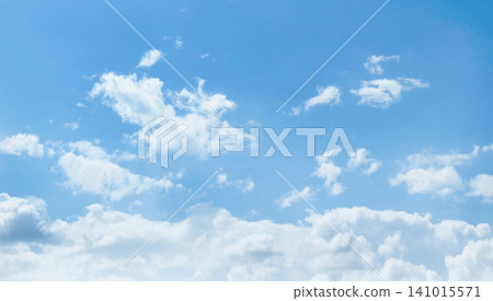 Clear blue sky with scattered white clouds Clear blue sky with scattered white clouds 141015571