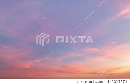 Soft clouds drift across a dreamy twilight sky Soft clouds drift across a dreamy twilight sky 141015574