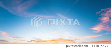 Blue sky stretches wide, painted with soft clouds Blue sky stretches wide, painted with soft clouds 141015577