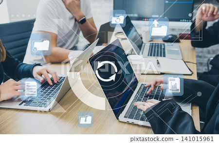 A scene from a business team meeting: Idea sharing, data sharing, and digital network integration. 141015961