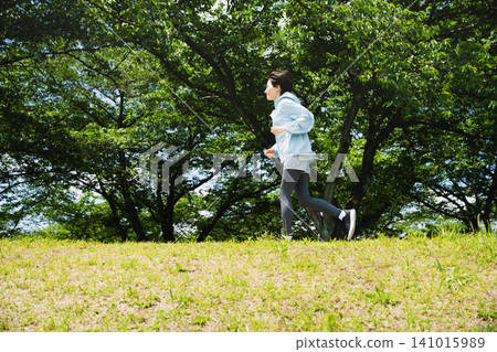 Young woman running sports image Young woman running sports image 141015989