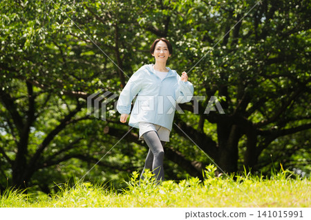 Young woman running sports image Young woman running sports image 141015991