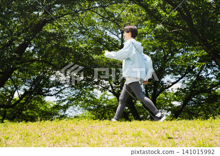 Young woman running sports image Young woman running sports image 141015992