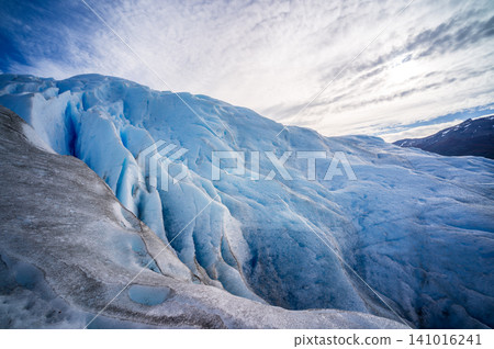 Perito Moreno glacier Patagonia Los Glaciares national park blue ice under dramatic cloud sky Perito Moreno glacier Patagonia Los Glaciares national park blue ice under dramatic cloud sky 141016241