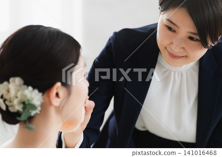 Bride with makeup on - wedding image Bride with makeup on - wedding image 141016468