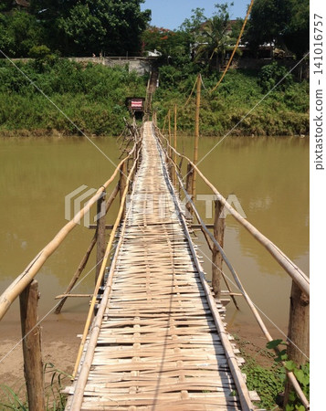 Laos Tourism: Tranquil Nature and Historic Bamboo Suspension Bridges Laos Tourism: Tranquil Nature and Historic Bamboo Suspension Bridges 141016757