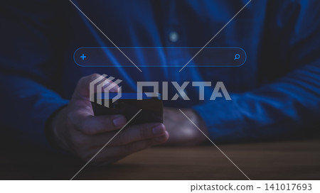 Man using smartphone for online search. Digital business technology concept for networking, mobile internet, and finding information. 141017693