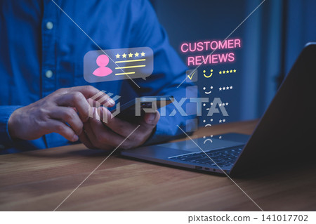 Man using smartphone for online customer review. Five star rating and satisfaction feedback concept for business service quality and digital experience. Man using smartphone for online customer review. Five star rating and satisfaction feedback concept for business service quality and digital experience. 141017702