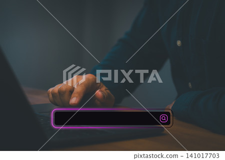 Man using laptop with virtual search bar. Internet browsing, web searching, online data finding, SEO optimization and technology business concept. Man using laptop with virtual search bar. Internet browsing, web searching, online data finding, SEO optimization and technology business concept. 141017703
