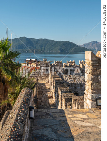 Castle courtyard with garden and ancient walls in Marmaris Turkey Castle courtyard with garden and ancient walls in Marmaris Turkey 141018202