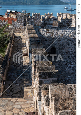 Medieval stone battlements overlooking sea bay in Marmaris Turkey 141018204