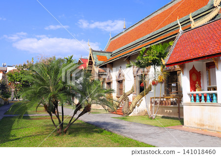 Buddhist temple in traditional Thai style, Chiang Mai, Thailand. Shrine in Buddhist temple, reflecting the traditional architecture of Thailand. Topic of vacation, travel, trip, cruises, tour Buddhist temple in traditional Thai style, Chiang Mai, Thailand. Shrine in Buddhist temple, reflecting the traditional architecture of Thailand. Topic of vacation, travel, trip, cruises, tour 141018460