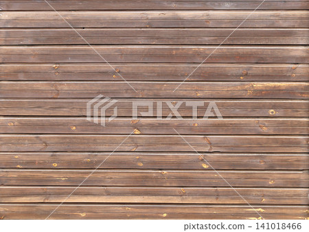 Texture of old wooden board of brown color. Horizontal or vertical background with weathered retro wood planks. Wall with pine boards trim. Texture of an aged wooden panels, its hue a deep brown Texture of old wooden board of brown color. Horizontal or vertical background with weathered retro wood planks. Wall with pine boards trim. Texture of an aged wooden panels, its hue a deep brown 141018466