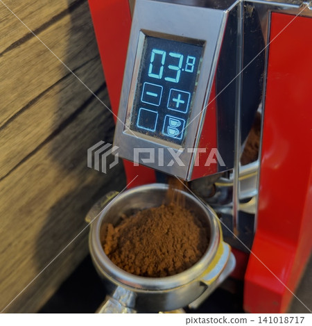 Filling with espresso coffee grounds Filling with espresso coffee grounds 141018717