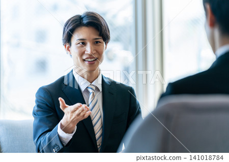 Business man having business talk in office Business man having business talk in office 141018784