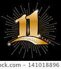 11 years anniversary. Golden stylized congratulation in the rays of fireworks and reflections. Idea for a banner, badge or label. Sticker for a festive gift 141018896