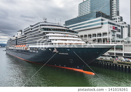 Side view of a cruise ship close up docked in the port in Vancouver British Columbia Canada. Cruise ships docked at Canada place. Holland America Line Noorland Cruise ship. Travel photo July 10,2022 Side view of a cruise ship close up docked in the port in Vancouver British Columbia Canada. Cruise ships docked at Canada place. Holland America Line Noorland Cruise ship. Travel photo July 10,2022 141019261