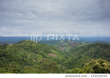 Mountain landscape green hill cloudy sky valley forest tropical panoramic view rural landscape lush vegetation scenic nature Mountain landscape green hill cloudy sky valley forest tropical panoramic view rural landscape lush vegetation scenic nature 141019345