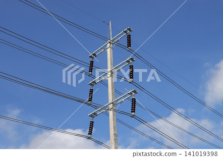 Power line tower electric pole overhead wire blue sky utility pole insulator cable transmission line electrical grid cloud Power line tower electric pole overhead wire blue sky utility pole insulator cable transmission line electrical grid cloud 141019398