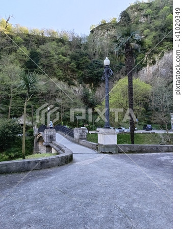 An old green park with old architecture, gazebos, and bridges. An old green park with old architecture, gazebos, and bridges. 141020349